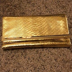 Michael Kors gold clutch bag